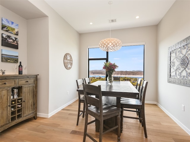 dining area featuring light wood-type flooring