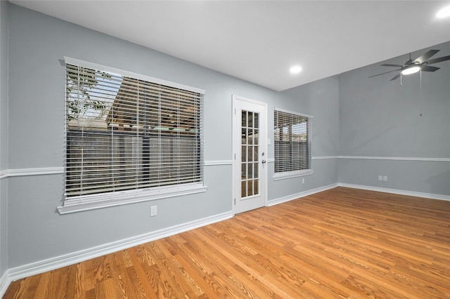 empty room with light wood-type flooring and ceiling fan