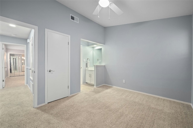 unfurnished bedroom featuring ceiling fan and light colored carpet