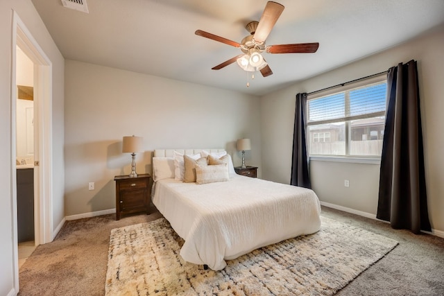 carpeted bedroom featuring ceiling fan and ensuite bathroom