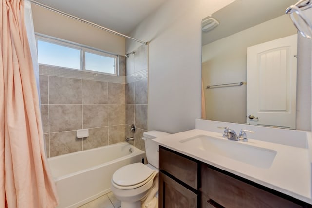 full bathroom with toilet, shower / bath combo, vanity, and tile patterned floors