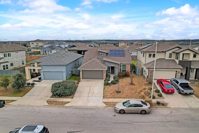 view of front of house with solar panels and a garage