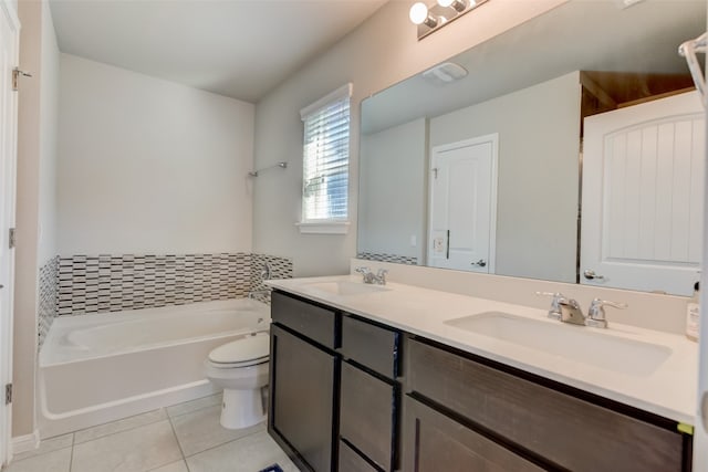 bathroom with toilet, tile patterned floors, a washtub, and vanity