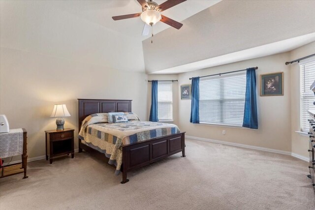 carpeted bedroom with high vaulted ceiling and ceiling fan