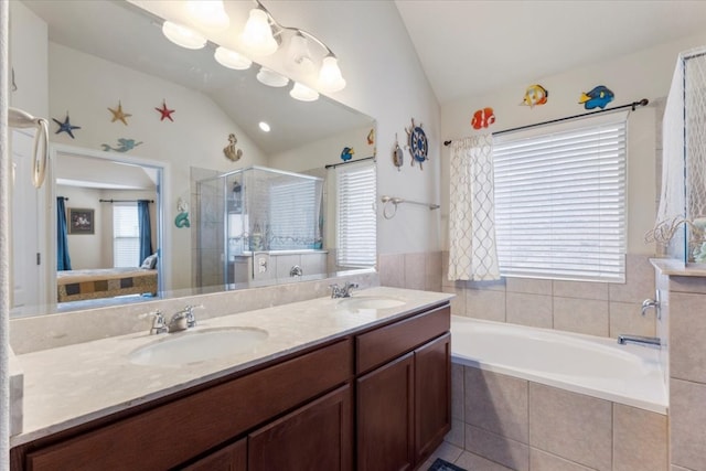 bathroom with plus walk in shower, vaulted ceiling, and dual bowl vanity