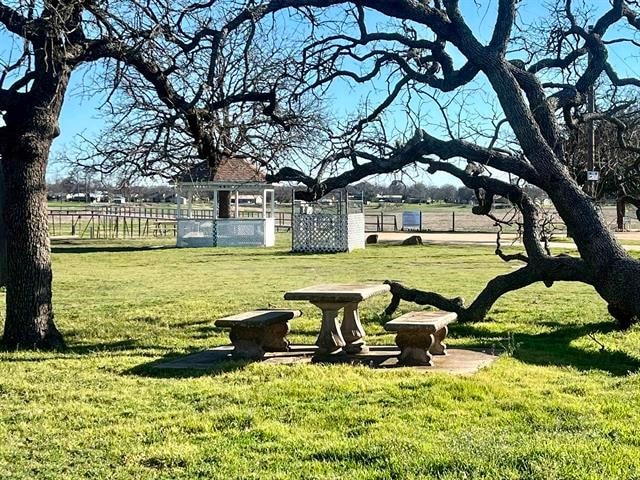 view of home's community with a lawn