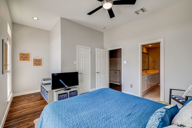 2918 Ranch Road 620 N Unit S-242, Austin, TX 78734 - bedroom featuring visible vents, wood finished floors, baseboards, connected bathroom, and a sink