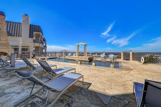 2918 Ranch Road 620 N Unit S-242, Austin, TX 78734 - view of patio / terrace with a water view, a community pool, and fence