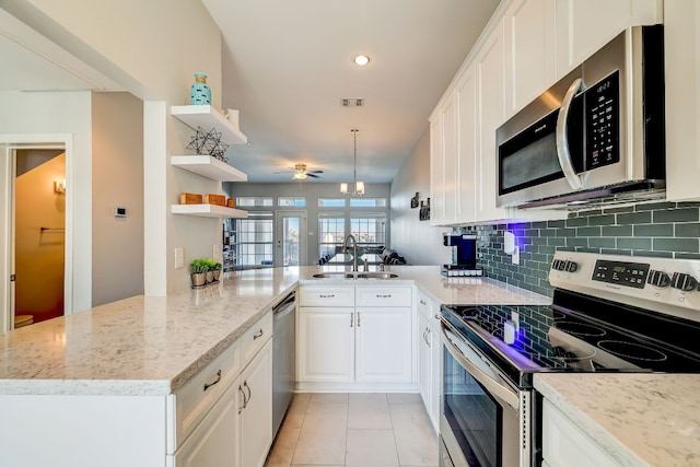 2918 Ranch Road 620 N Unit S-242, Austin, TX 78734 - kitchen featuring open shelves, appliances with stainless steel finishes, ceiling fan, a sink, and a peninsula