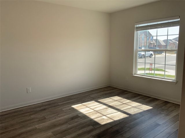 spare room featuring dark hardwood / wood-style floors