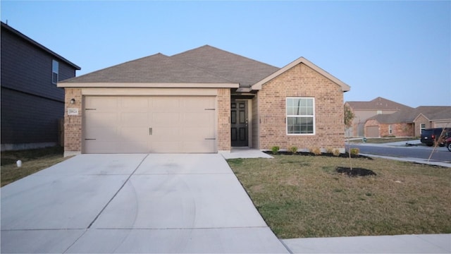 single story home featuring a front lawn and a garage