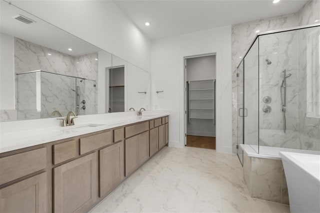 bathroom featuring vanity and plus walk in shower