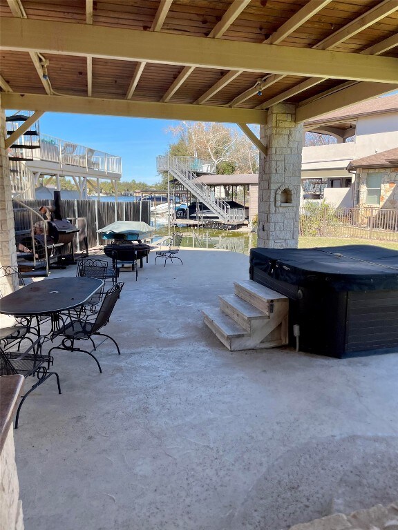 view of patio / terrace featuring a hot tub