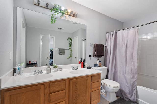 full bathroom featuring shower / tub combo, toilet, double sink, and oversized vanity