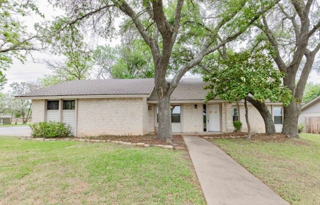 ranch-style home with a front yard