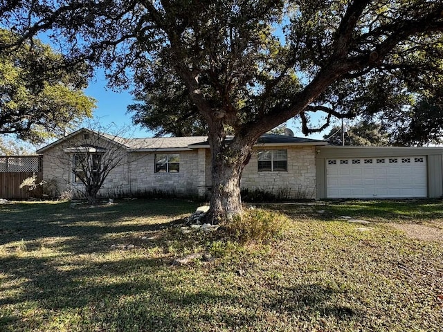 view of front facade with a front yard and a garage