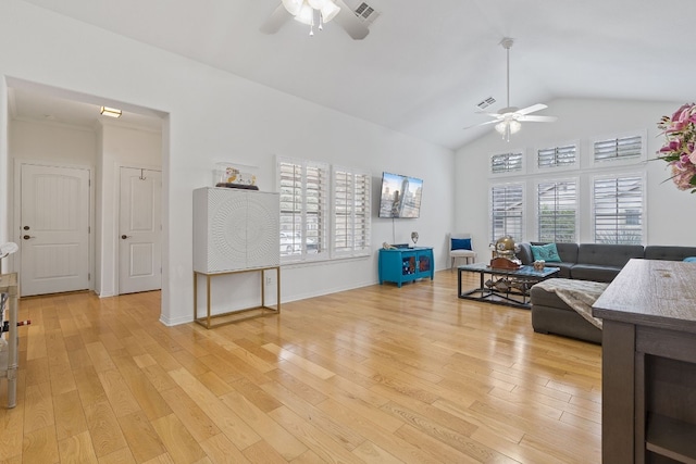 living room with vaulted ceiling, ceiling fan, and light hardwood / wood-style flooring