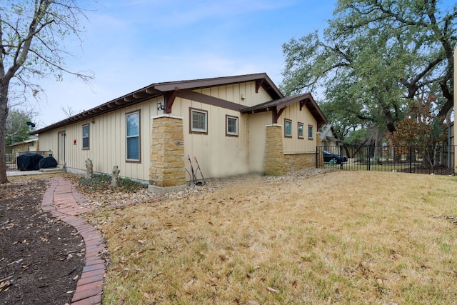 view of side of home featuring a yard