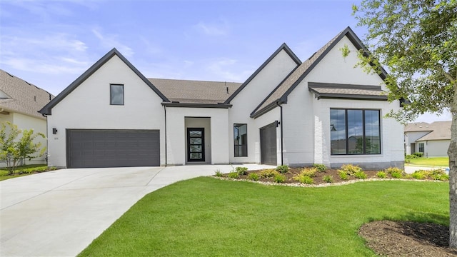 modern farmhouse style home featuring a front lawn and a garage