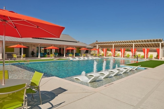 pool with a patio area and a pergola