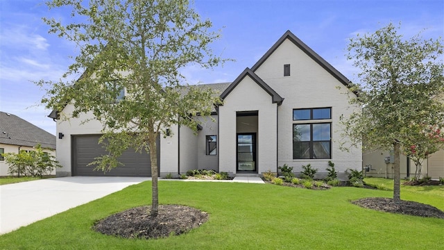 modern farmhouse style home with a garage and a front lawn