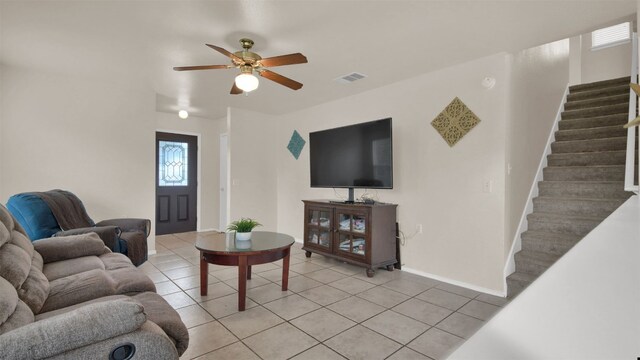 living room with light tile patterned flooring and ceiling fan