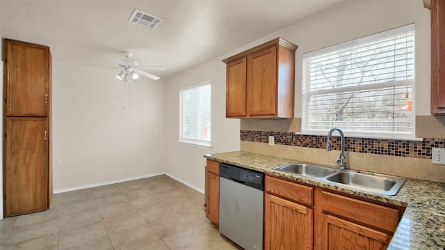 kitchen featuring stainless steel dishwasher, ceiling fan, tasteful backsplash, sink, and light tile patterned floors