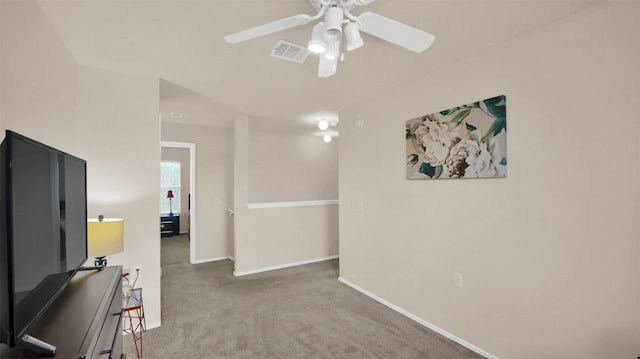 interior space with carpet and ceiling fan