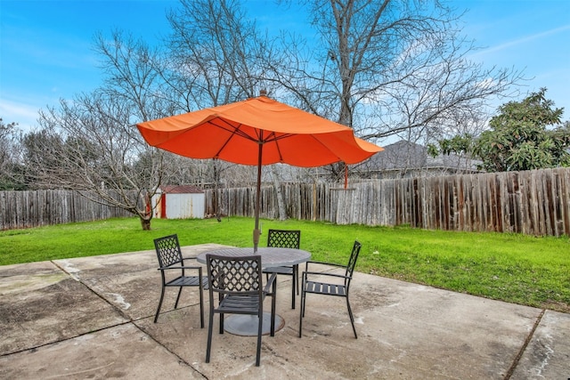 view of patio with a storage shed