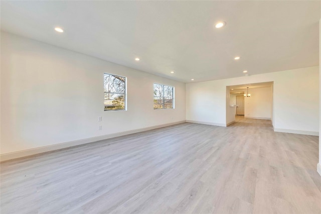 spare room featuring light wood-type flooring