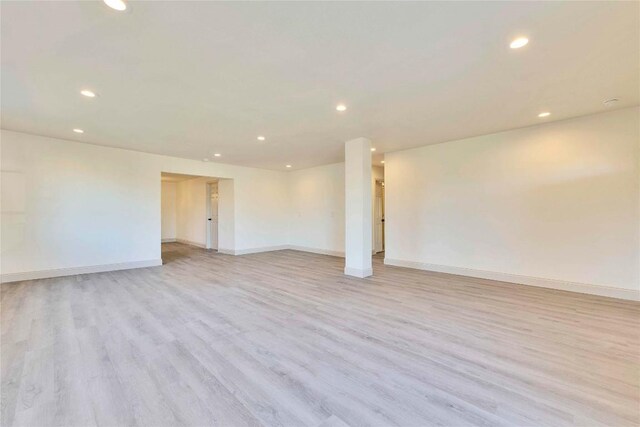 spare room with light hardwood / wood-style floors