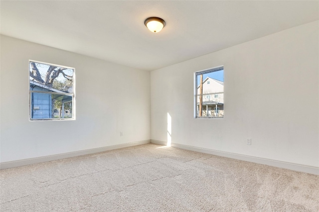 unfurnished room featuring carpet