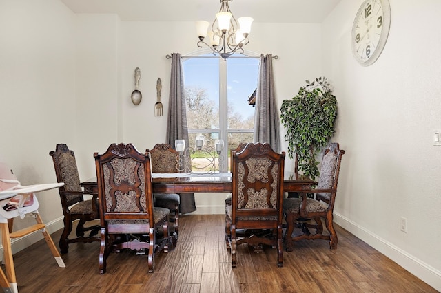 living area featuring dark hardwood / wood-style flooring and a chandelier