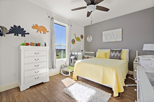 bedroom with wood-type flooring and ceiling fan