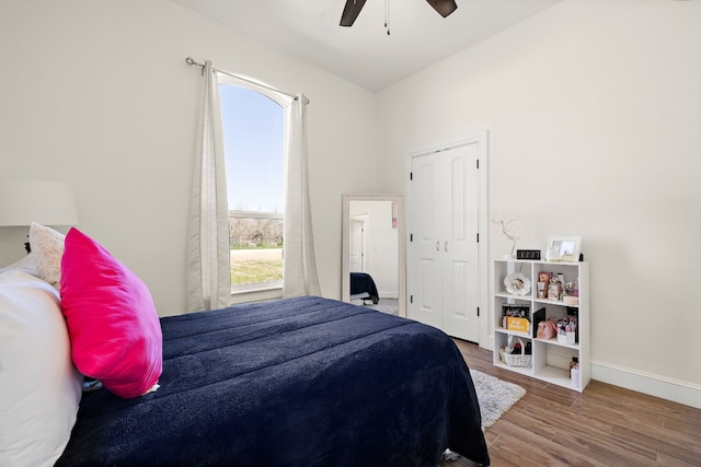 bedroom featuring a closet, ceiling fan, and hardwood / wood-style flooring