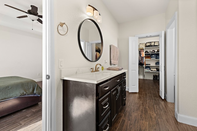 bathroom with vanity, ceiling fan, and hardwood / wood-style flooring