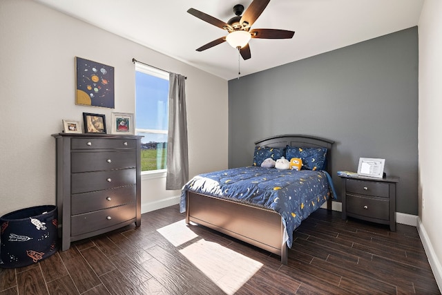 bedroom with ceiling fan and dark hardwood / wood-style flooring