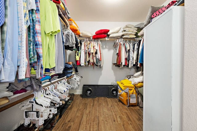 walk in closet featuring hardwood / wood-style flooring