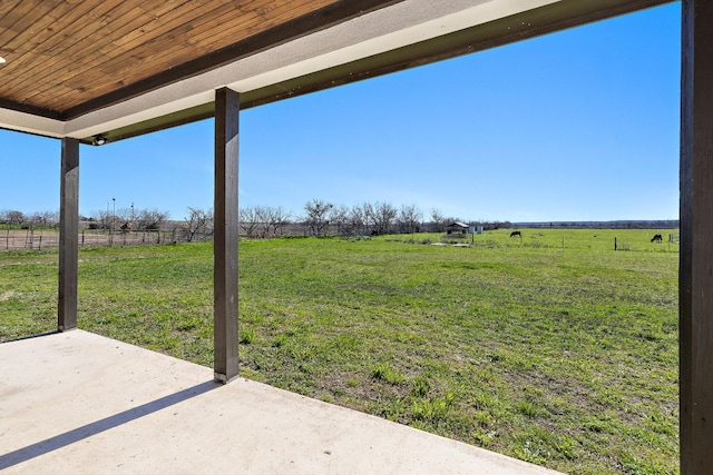 view of yard with a patio area and a rural view