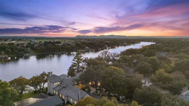 aerial view at dusk with a water view