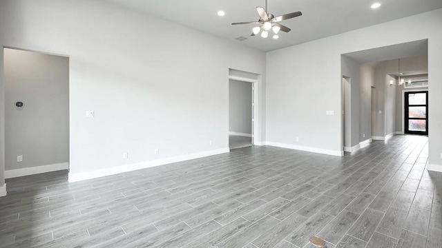 unfurnished room with ceiling fan and light wood-type flooring