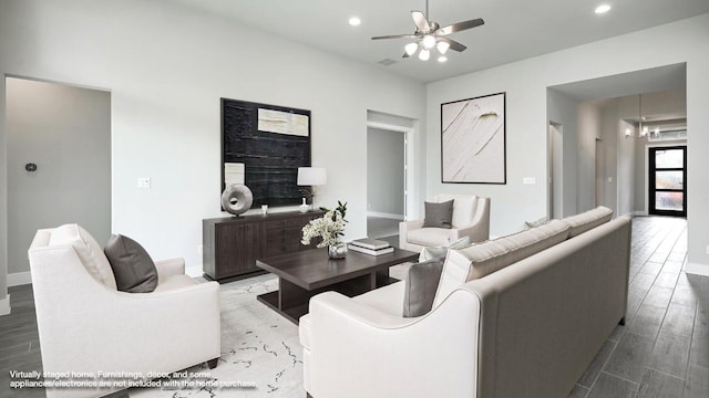 living room with ceiling fan and hardwood / wood-style flooring