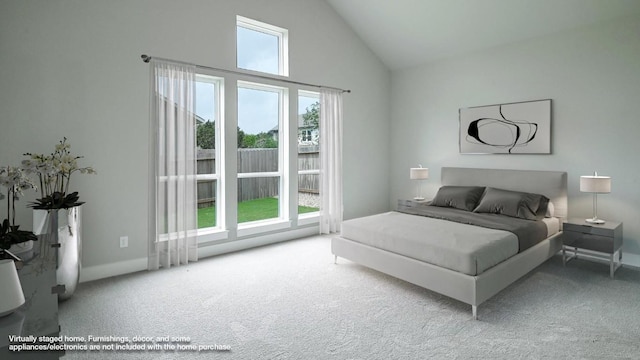 carpeted bedroom with high vaulted ceiling and multiple windows