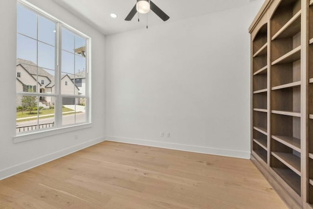 unfurnished room featuring light wood-type flooring and ceiling fan