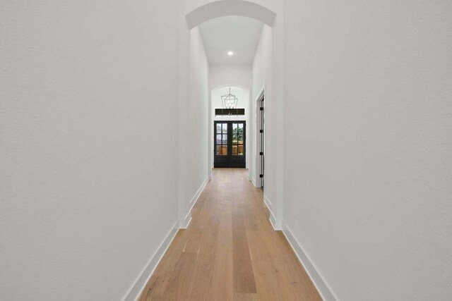 hall with light hardwood / wood-style floors