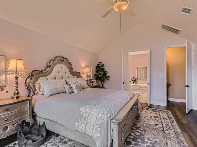 bedroom featuring connected bathroom, vaulted ceiling, visible vents, and dark wood-type flooring