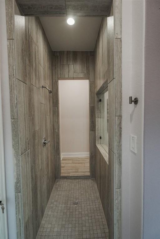 bathroom with tiled shower