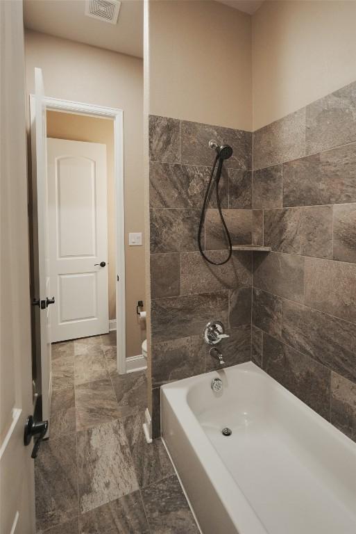 full bath featuring visible vents and shower / bathing tub combination