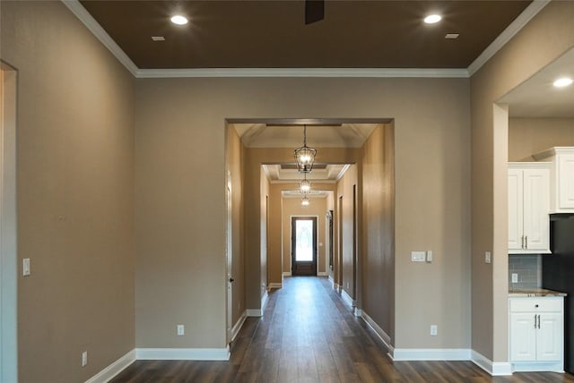 corridor featuring ornamental molding, recessed lighting, dark wood-style flooring, and baseboards