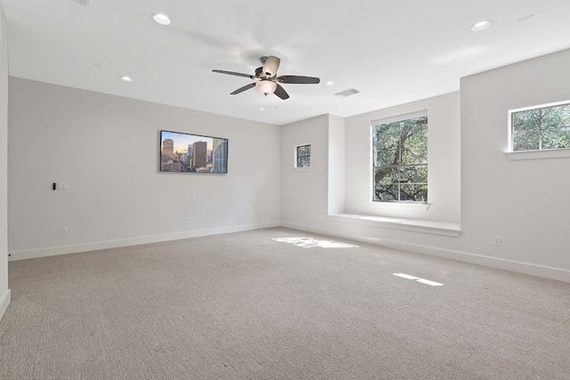 carpeted empty room with ceiling fan